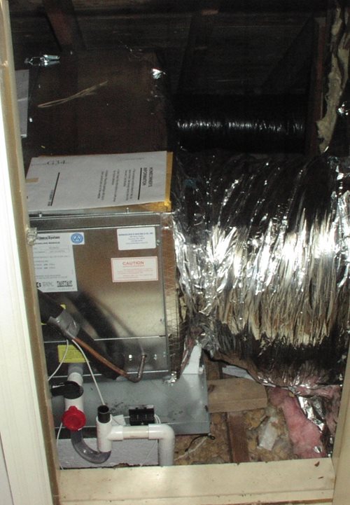 Unico high velocity air handler installed in Knee wall